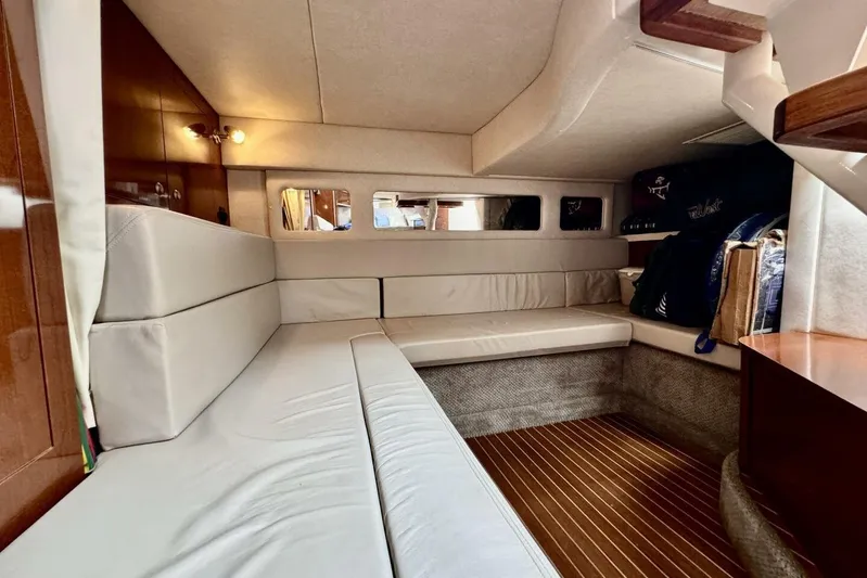  Yacht Photos Pics 2008 Sea Ray 330 Sundancer cabin interior with beige seating and wooden flooring.