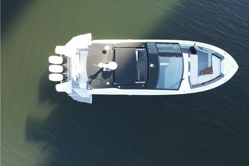  Yacht Photos Pics Top view of 2021 Cruisers Yachts 42 GLS OB on calm water.