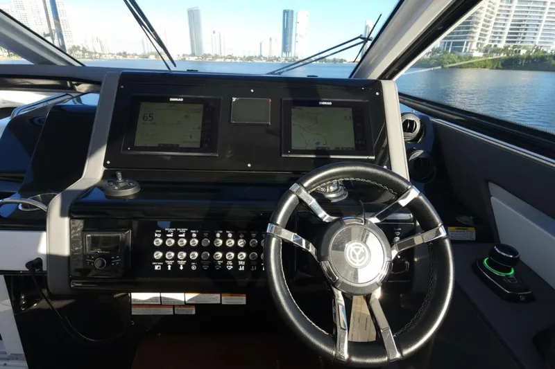  Yacht Photos Pics 2021 Cruisers Yachts 42 GLS OB helm with dual Simrad displays and steering wheel.