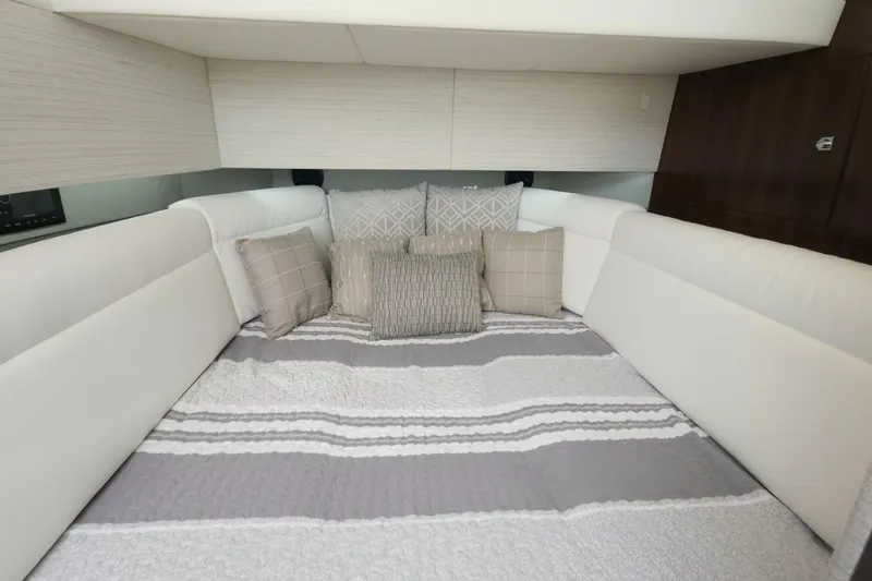  Yacht Photos Pics Luxurious cabin interior of 2021 Cruisers Yachts 42 GLS OB with plush bedding.