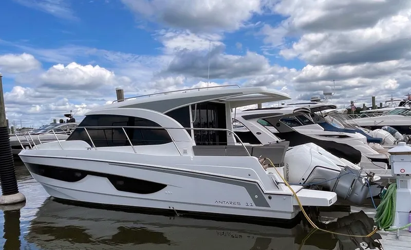 Rub A Dub Yacht Photos Pics 2023 Beneteau Antares 11 OB docked, showcasing sleek design and modern features.