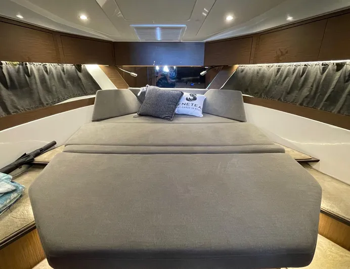 Rub A Dub Yacht Photos Pics Luxurious interior cabin of 2023 Beneteau Antares 11 OB with cozy bedding.