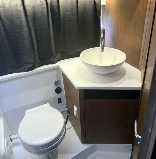 Rub A Dub Yacht Photos Pics 2023 Beneteau Antares 11 OB bathroom with modern sink and toilet.