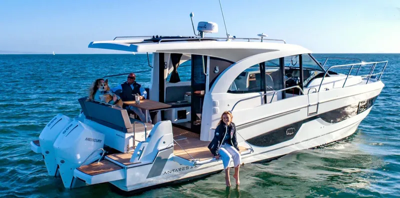 Rub A Dub Yacht Photos Pics 2023 Beneteau Antares 11 OB cruising on the ocean with passengers enjoying the view.