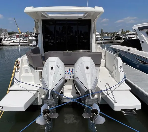 Rub A Dub Yacht Photos Pics 2023 Beneteau Antares 11 OB with dual outboard engines docked at marina.