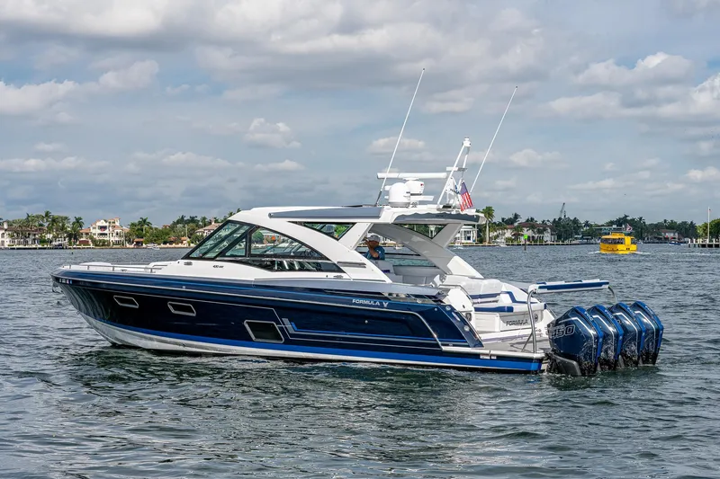  Yacht Photos Pics 2022 Formula 430 SSC boat cruising on a sunny day with four outboard engines.