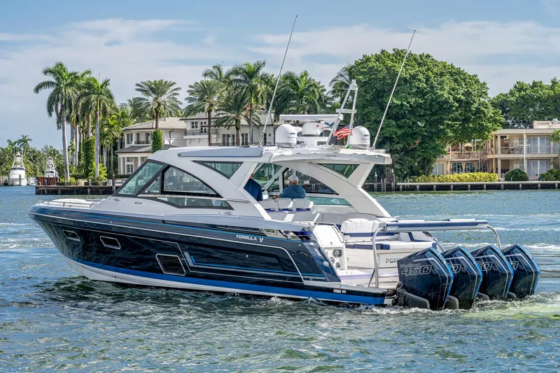  Yacht Photos Pics 2022 Formula 430 SSC luxury boat cruising near waterfront homes.
