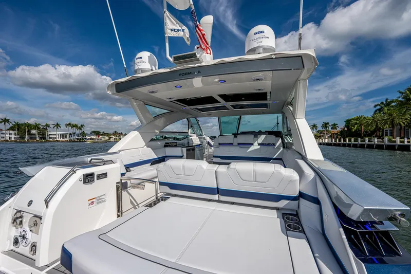  Yacht Photos Pics 2022 Formula 430 SSC luxury boat with spacious seating and sleek design on a sunny day.