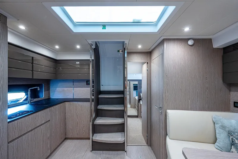  Yacht Photos Pics Luxurious interior of 2021 Azimut Atlantis 45 yacht with modern kitchen and seating area.
