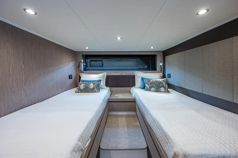  Yacht Photos Pics Luxurious cabin interior of 2021 Azimut Atlantis 45 yacht with twin beds and modern decor.