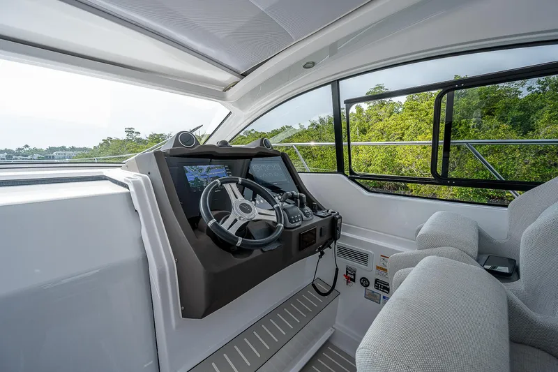  Yacht Photos Pics Helm of 2021 Azimut Atlantis 45 yacht with modern controls and panoramic view.