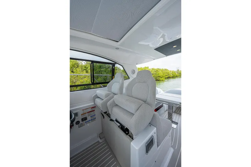  Yacht Photos Pics Interior of 2021 Azimut Atlantis 45 yacht with plush seating and scenic window view.