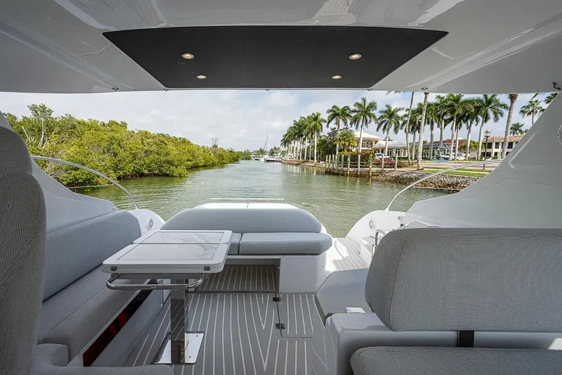  Yacht Photos Pics 2021 Azimut Atlantis 45 yacht interior with scenic waterfront view.