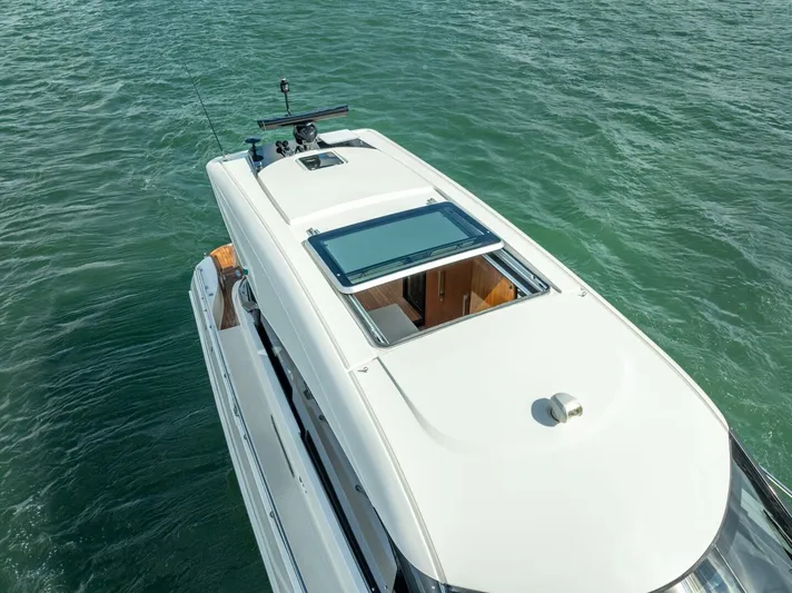 Man Cave Yacht Photos Pics 2021 Maritimo X50 yacht on water, aerial view showcasing sleek design.