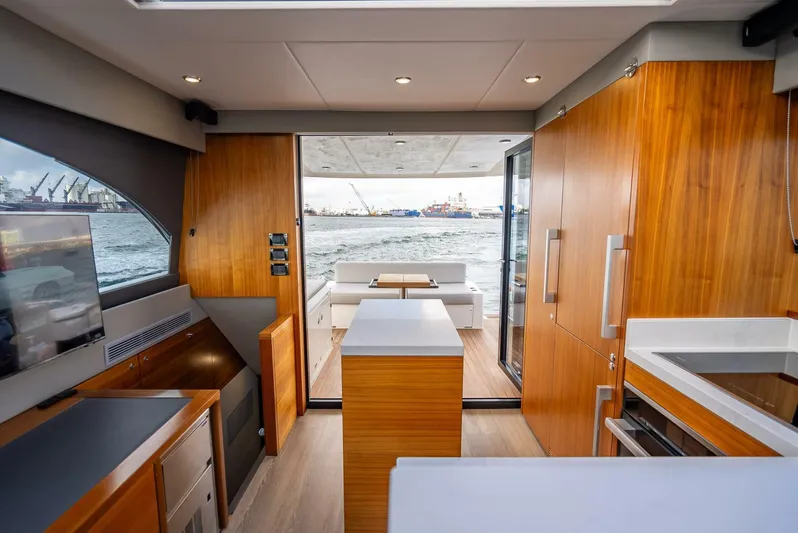 Man Cave Yacht Photos Pics 2021 Maritimo X50 yacht interior with modern wood finishes and ocean view.
