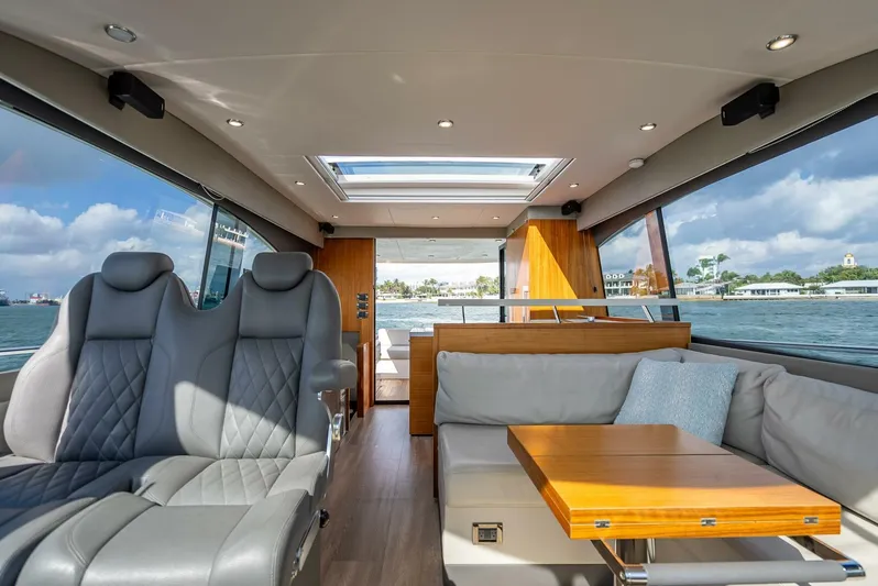 Man Cave Yacht Photos Pics Interior of 2021 Maritimo X50 yacht with luxurious seating and panoramic windows.