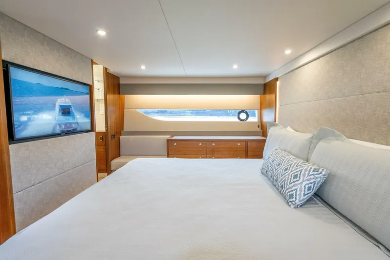 Man Cave Yacht Photos Pics Luxurious interior of 2021 Maritimo X50 yacht with modern bedroom and large window.