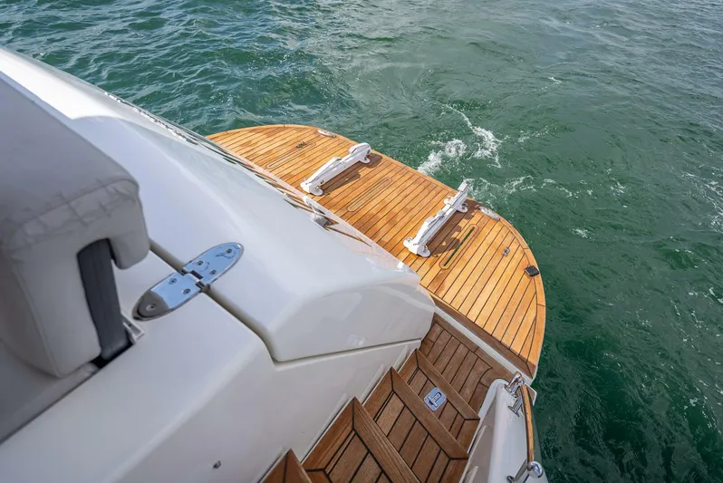 Man Cave Yacht Photos Pics 2021 Maritimo X50 yacht with teak swim platform on water.