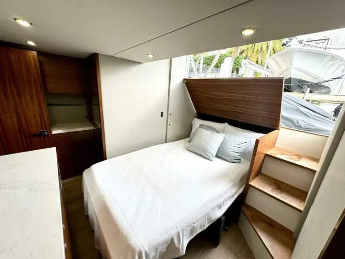 Man Cave Yacht Photos Pics 2021 Maritimo X50 yacht interior bedroom with modern design and wooden accents.