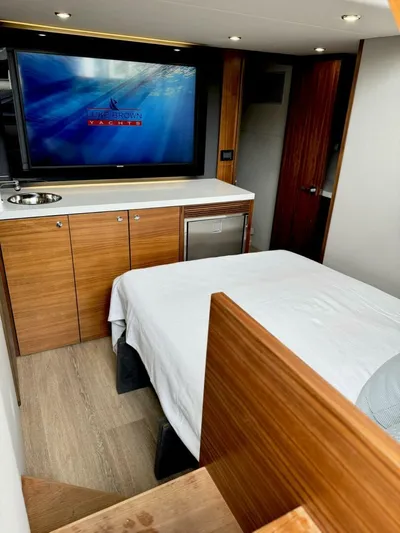 Man Cave Yacht Photos Pics Interior of 2021 Maritimo X50 yacht with modern wood cabinetry and a large TV.