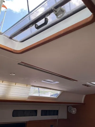Hygge Yacht Photos Pics Interior view of 2017 Jeanneau Sun Odyssey 479 yacht, featuring skylight and modern design.