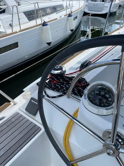 Hygge Yacht Photos Pics Steering wheel and compass on 2017 Jeanneau Sun Odyssey 479 sailboat.