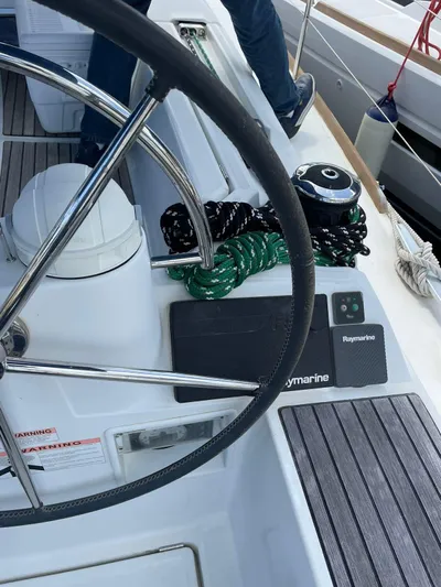 Hygge Yacht Photos Pics Steering wheel and navigation equipment on a 2017 Jeanneau Sun Odyssey 479 sailboat.