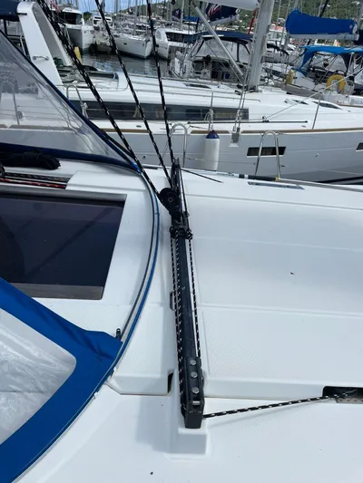 Hygge Yacht Photos Pics 2017 Jeanneau Sun Odyssey 479 sailboat deck with rigging and marina background.