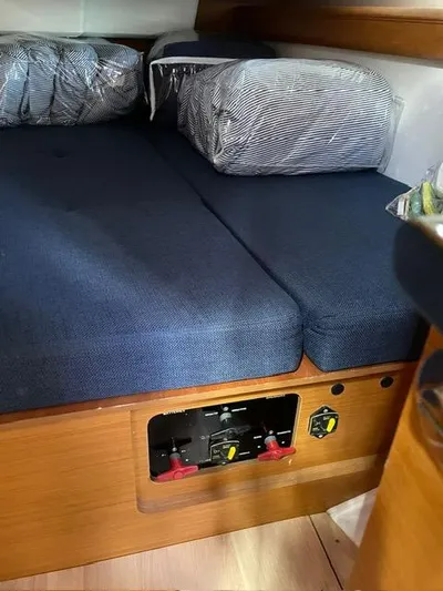Hygge Yacht Photos Pics Interior cabin of 2017 Jeanneau Sun Odyssey 479 yacht with blue cushions.