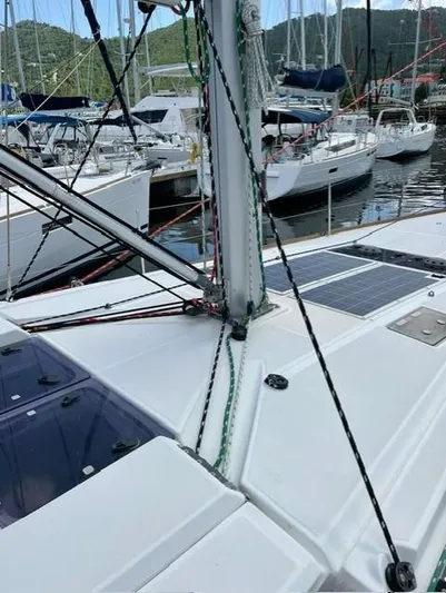 Hygge Yacht Photos Pics 2017 Jeanneau Sun Odyssey 479 sailboat docked in a marina, showcasing deck and rigging.