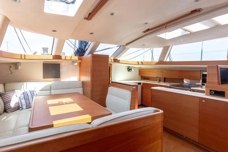 Caiarossa Yacht Photos Pics Luxurious interior of 2009 Seaway Shipman 72 yacht with modern kitchen and seating area.