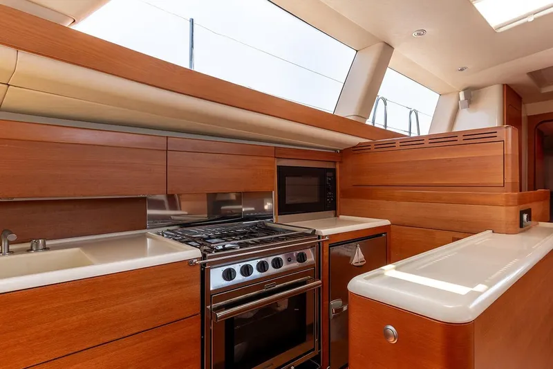Caiarossa Yacht Photos Pics Luxurious 2009 Seaway Shipman 72 yacht kitchen with modern appliances and sleek wood finish.