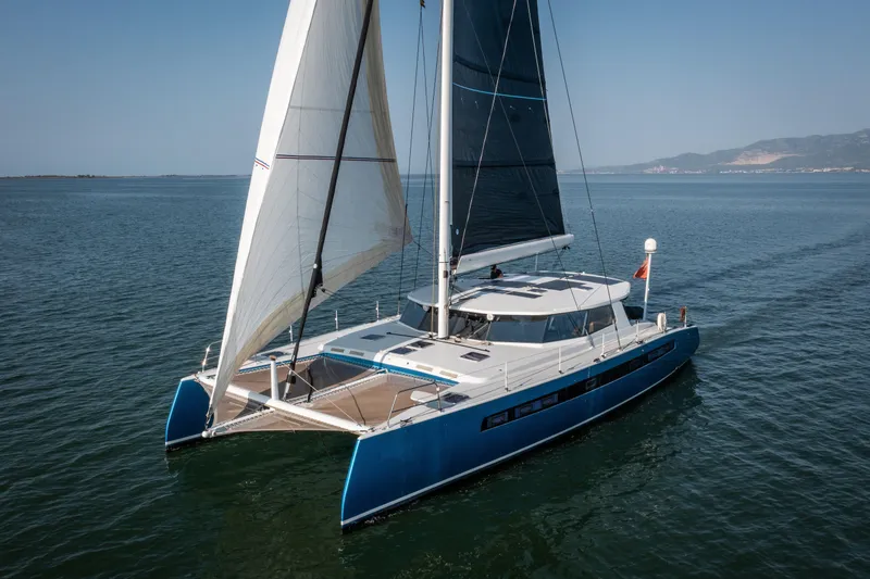 Ondine Blue Yacht Photos Pics Sleek Balance 526 catamaran sailing on calm waters, 2016 model.