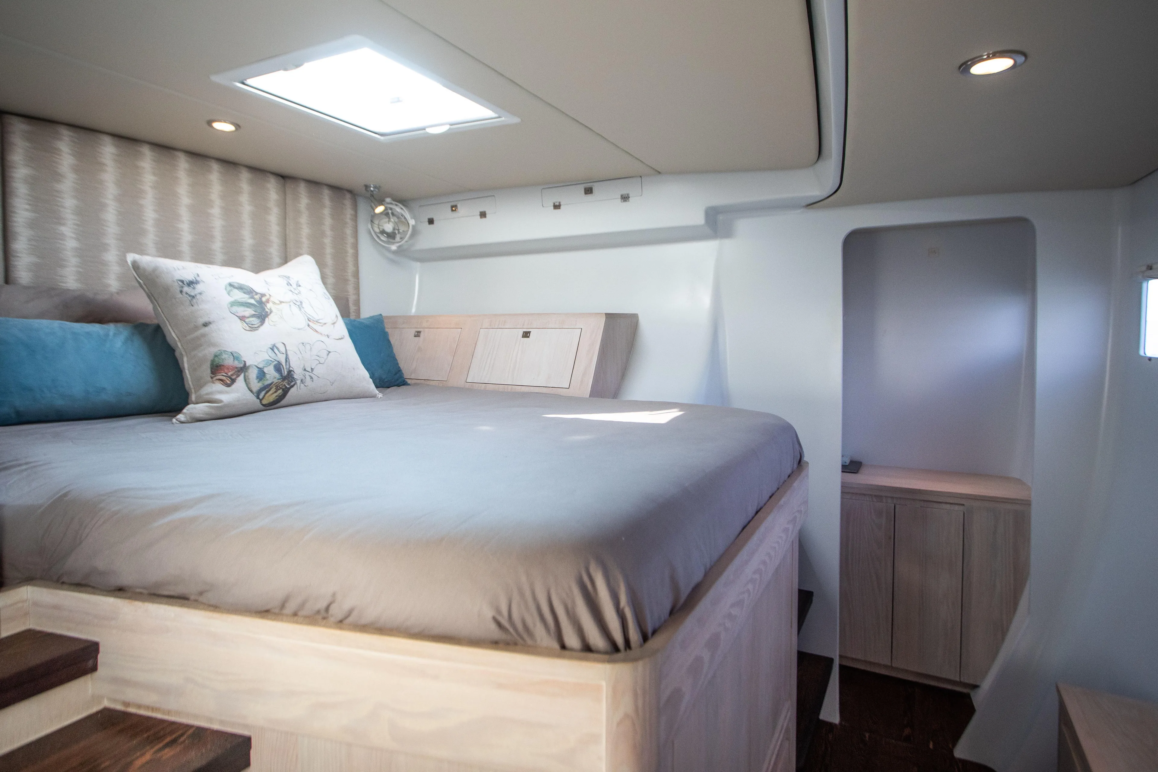 Ondine Blue Yacht Photos Pics Luxurious cabin interior of 2016 Balance 526 yacht with cozy bed and elegant decor.