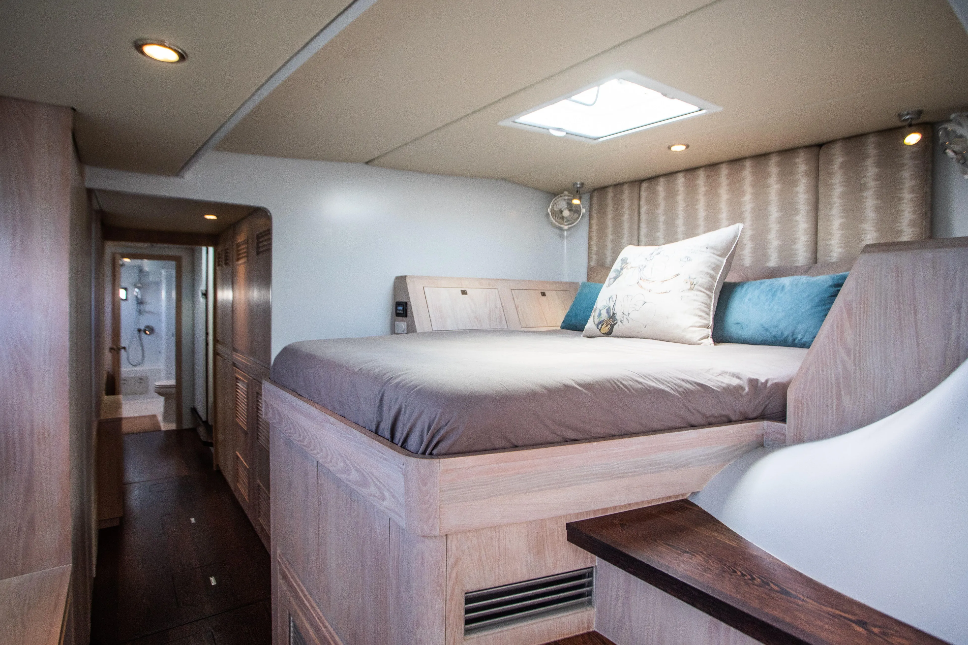 Ondine Blue Yacht Photos Pics Luxurious bedroom interior in 2016 Balance 526 yacht, featuring elegant wood finishes and cozy bedding.