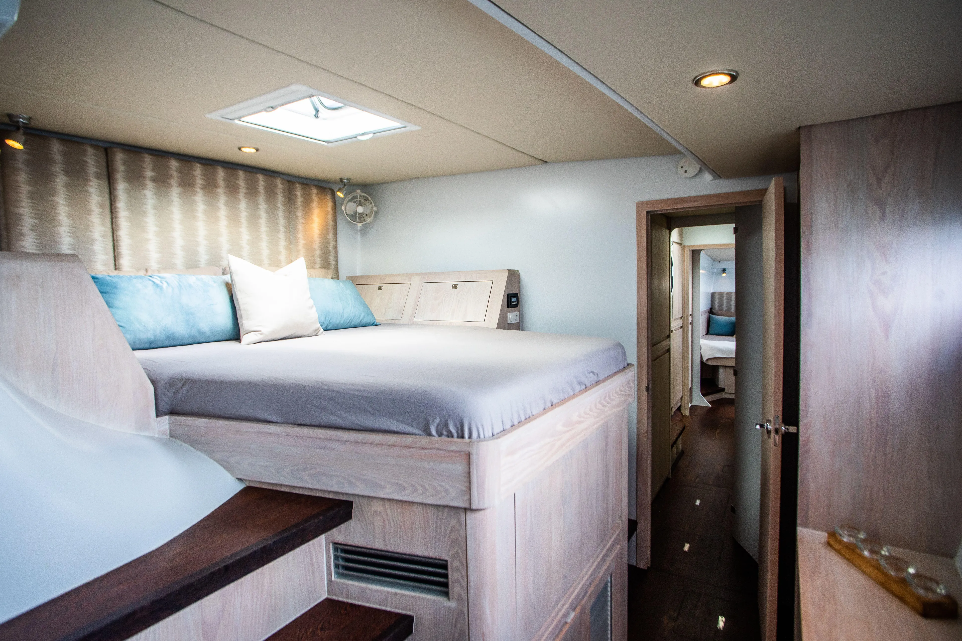 Ondine Blue Yacht Photos Pics Luxurious bedroom interior in 2016 Balance 526 yacht, featuring elevated bed and modern design.
