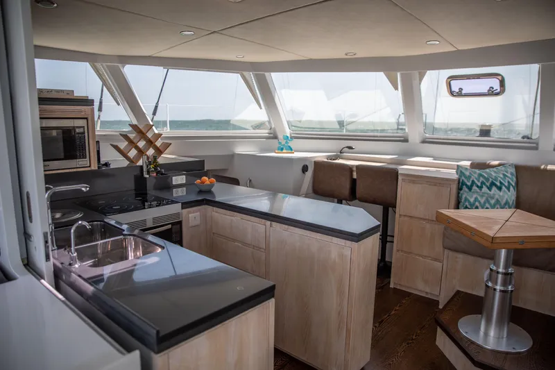 Ondine Blue Yacht Photos Pics Luxurious 2016 Balance 526 yacht interior with modern kitchen and seating area.