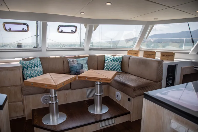 Ondine Blue Yacht Photos Pics Luxurious interior of 2016 Balance 526 yacht with plush seating and scenic windows.