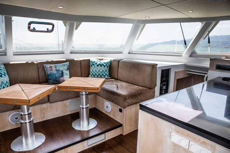 Ondine Blue Yacht Photos Pics Luxurious interior of 2016 Balance 526 yacht with plush seating and modern design.