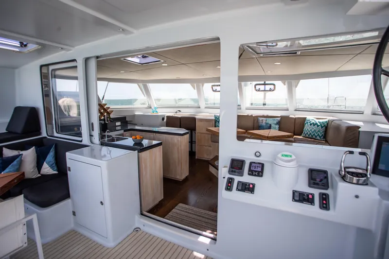 Ondine Blue Yacht Photos Pics Luxurious interior of 2016 Balance 526 catamaran with modern seating and navigation controls.