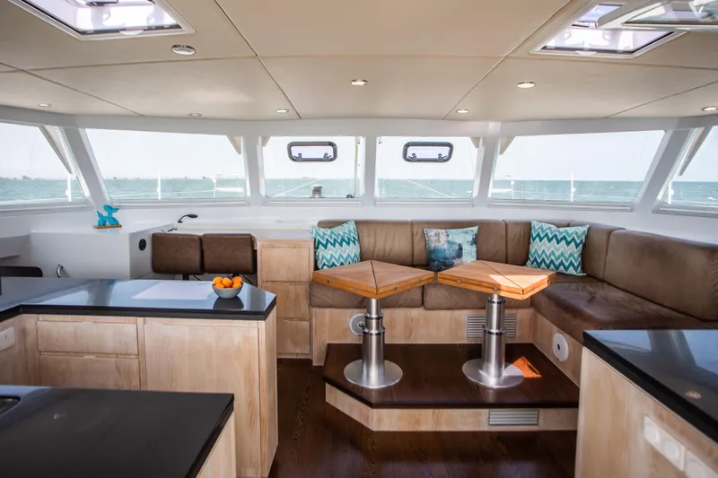 Ondine Blue Yacht Photos Pics Luxurious interior of 2016 Balance 526 yacht with modern seating and ocean view.