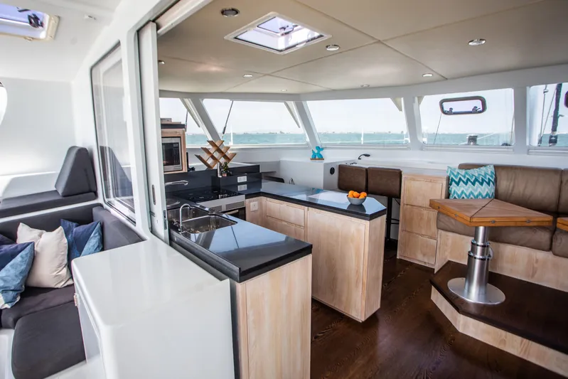 Ondine Blue Yacht Photos Pics Luxurious interior of 2016 Balance 526 yacht with modern kitchen and seating area.