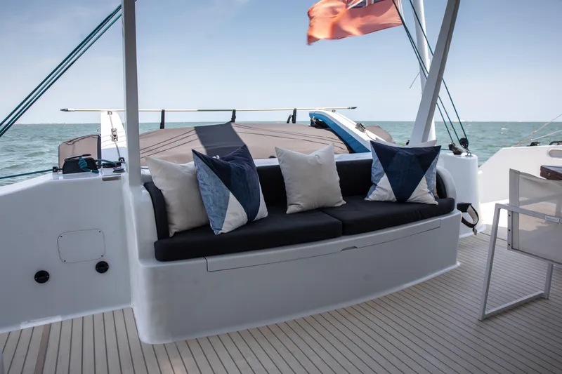 Ondine Blue Yacht Photos Pics Luxurious seating area on 2016 Balance 526 yacht with ocean view and decorative pillows.