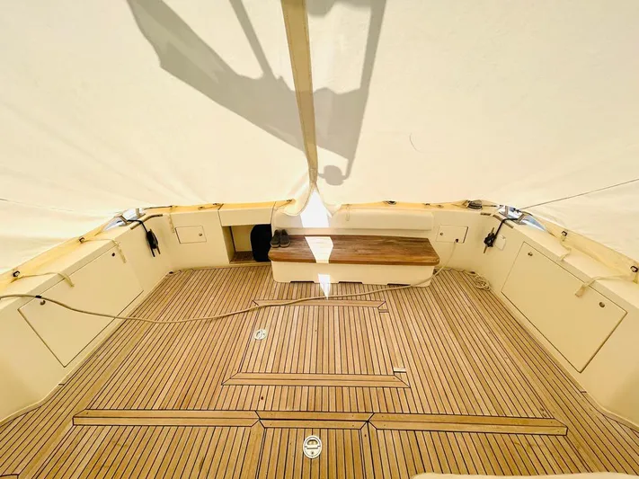  Yacht Photos Pics Spacious deck of 2000 Uniesse 57 yacht with wooden flooring and seating.