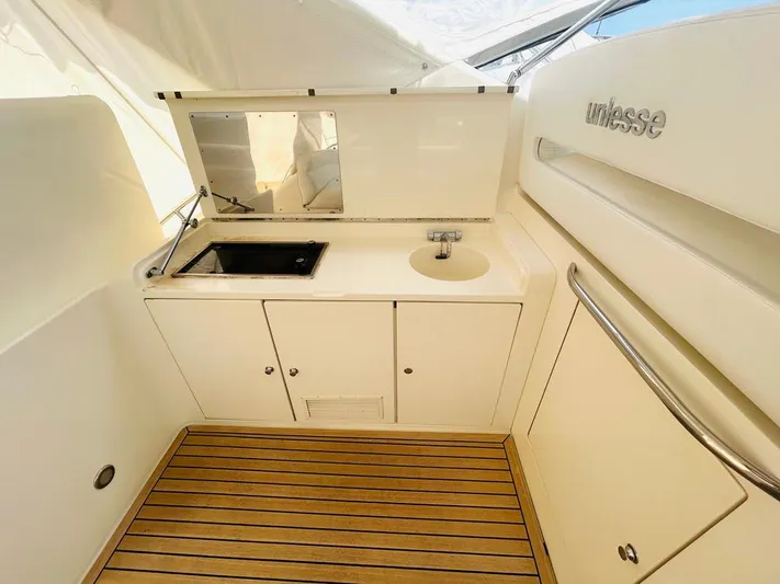  Yacht Photos Pics Luxury Uniesse 57 yacht kitchenette with sink and storage, 2000 model.