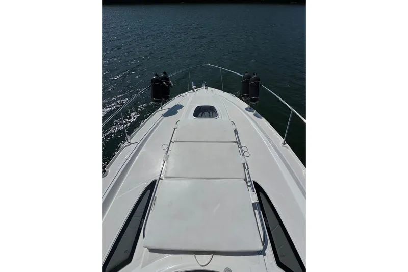  Yacht Photos Pics 2008 Sea Ray 330 Sundancer boat deck on calm water.