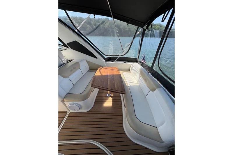  Yacht Photos Pics Interior of 2008 Sea Ray 330 Sundancer yacht with elegant seating and wooden table.