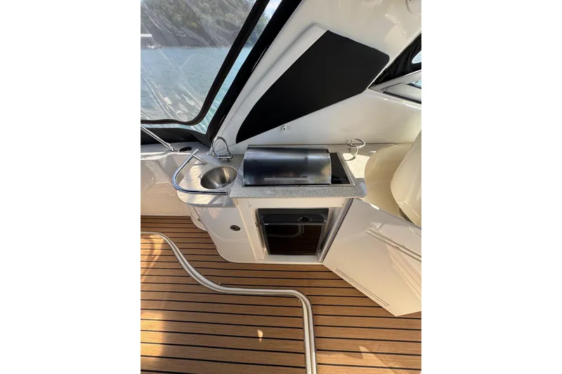  Yacht Photos Pics 2008 Sea Ray 330 Sundancer boat interior with kitchenette and wooden flooring.