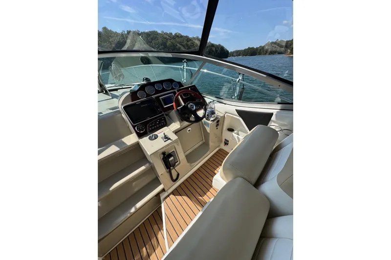  Yacht Photos Pics 2008 Sea Ray 330 Sundancer cockpit with modern controls and scenic water view.