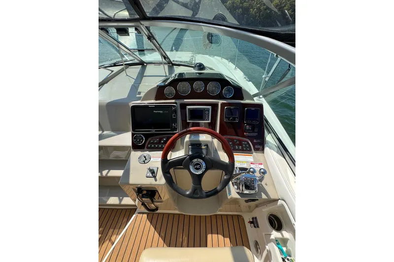 Yacht Photos Pics 2008 Sea Ray 330 Sundancer helm with modern controls and wood accents.